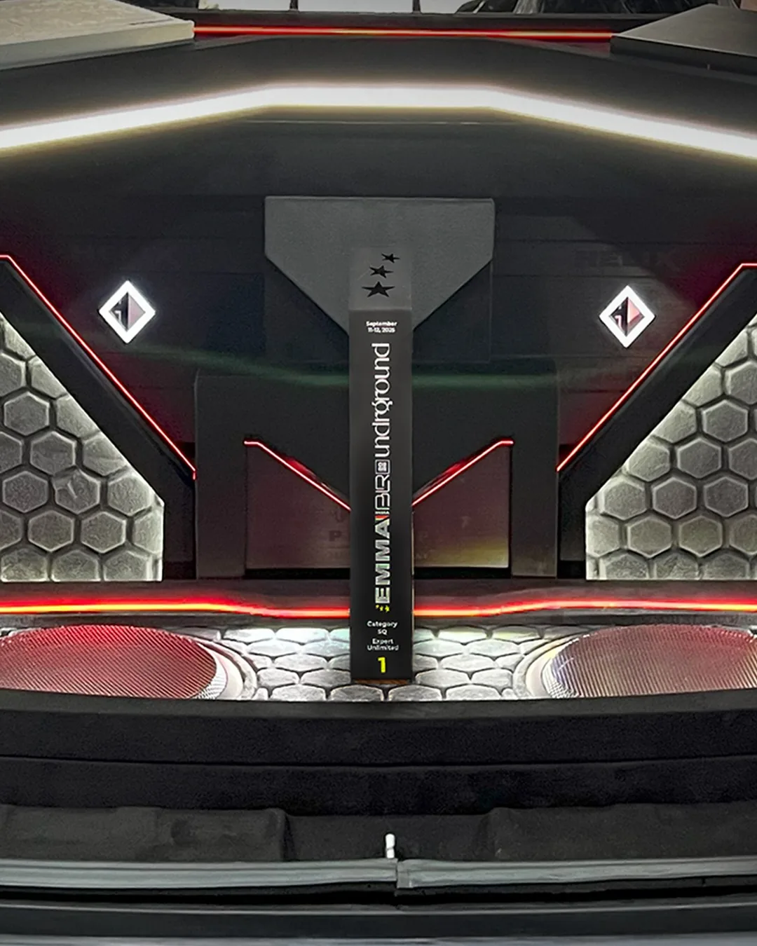 Expert Unlimited competition installation with its first-place trophy and illuminated custom boot