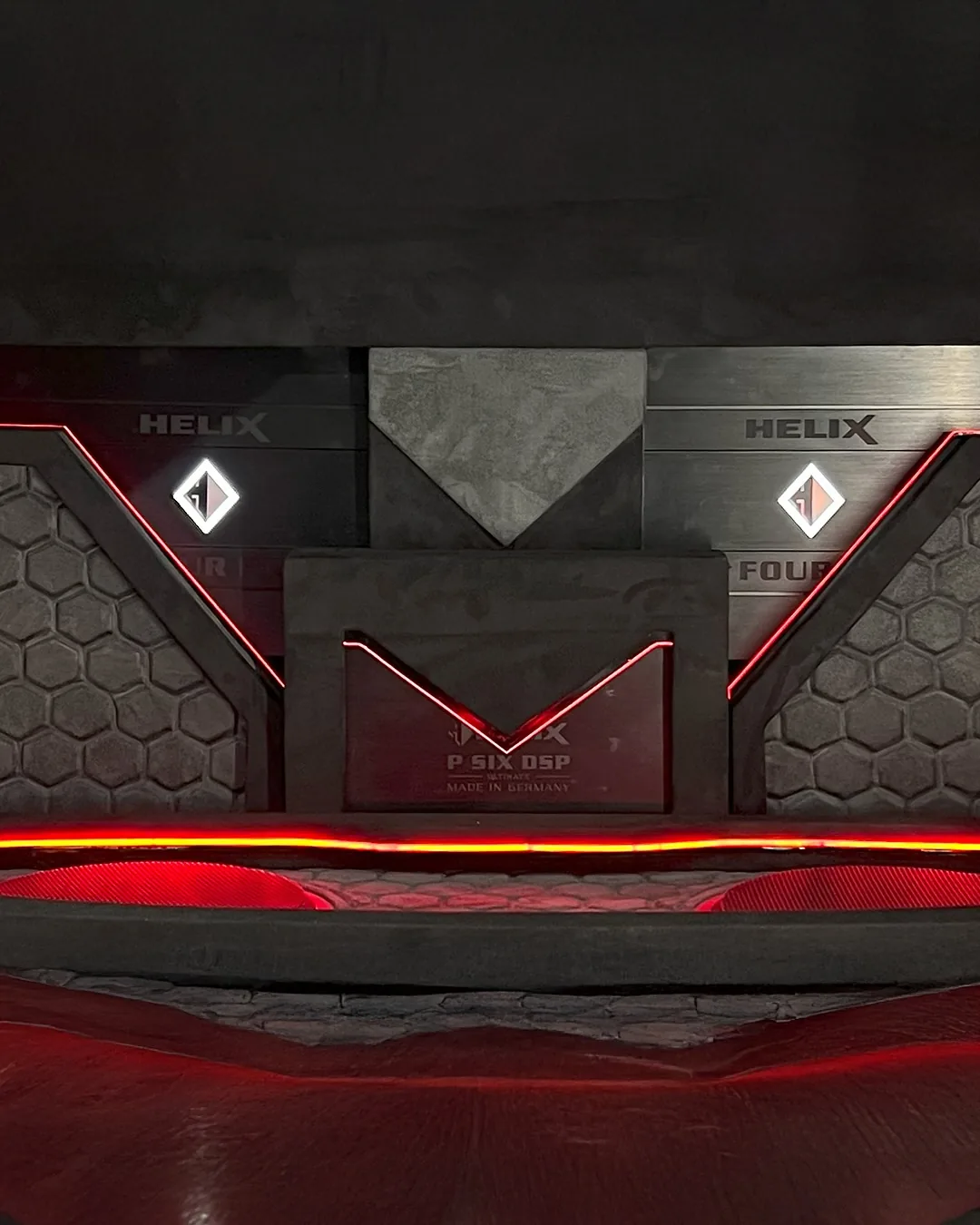 Close view of the competition car’s custom installation, with Helix equipment and red accent lighting