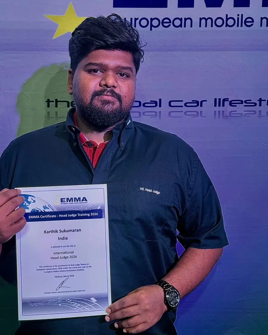 Karthik Sukumaran holding the EMMA International Head Judge certificate